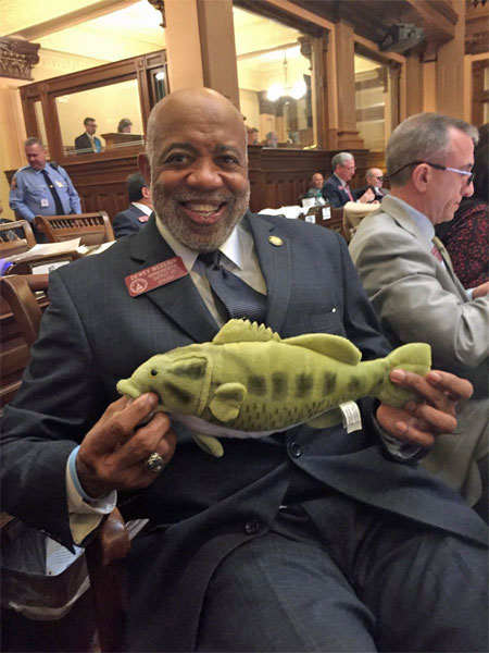 Dewey McClain holding a toy fish!