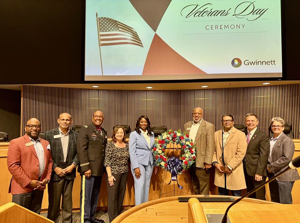 Group picture with Dewey McClain and others at Veterans day ceremony at Gwinnett Justice Center